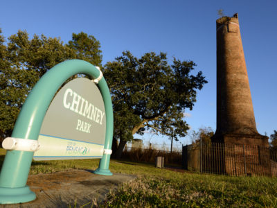 Located along Pensacola Scenic Bluffs Highway, Chimney Park contains an approximately 50-foot high brick chimney, remnants of a pre-Civil war era sawmill. The property is configured as a mini park functioning as a roadside rest area containing parking spaces and brick walkways.