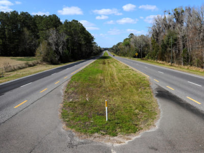 Cars travel along a section of the Old Florida Heritage Highway near Micanopy.