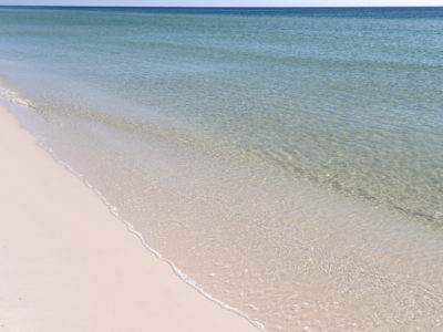 The crystal clear waters of the Gulf of Mexico are just steps away from Scenic Highway 30A. | Photo by: Andrew Wardlow