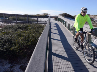 Mike Page enjoys a bike ride through Grayton Beach State Park just off of Scenic Highway 30-A. Consistently ranking among the most beautiful and pristine beaches in the U.S., the nearly 2,000-acre state park boasts more than four miles of trails for hiking and biking. | Photo by: Andrew Wardlow