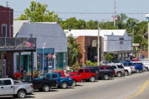 Visitors cross U.S. Highway 98 in Apalachicola's business district..COLIN HACKLEY PHOTO