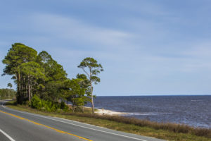 An RV drives along the Gulf of Mexico while traveling U.S. Highway 98 on the Coastal Trail portion of the Big Bend Scenic Byway west of Carrabelle. COLIN HACKLEY PHOTO