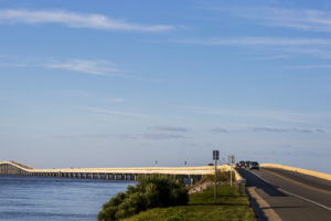 Motorists drive the causeway from the mainland to St. George Island on the Coastal Trail of the Big Bend Scenic Byway. COLIN HACKLEY PHOTO