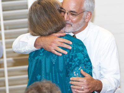 Jeff Caster hugs Judy Hull as she is awarded the 2019 Garry Balogh Inspiring Excellence Award